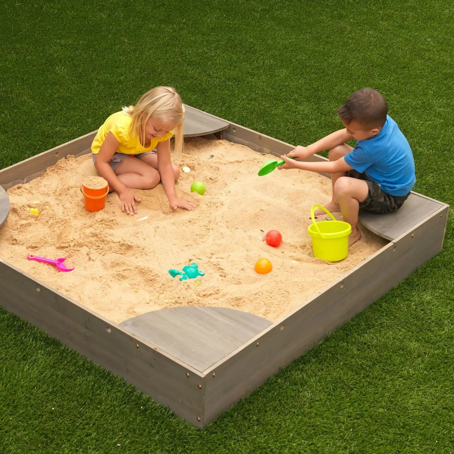 KidKraft Sandbox in the backyard KidKraft