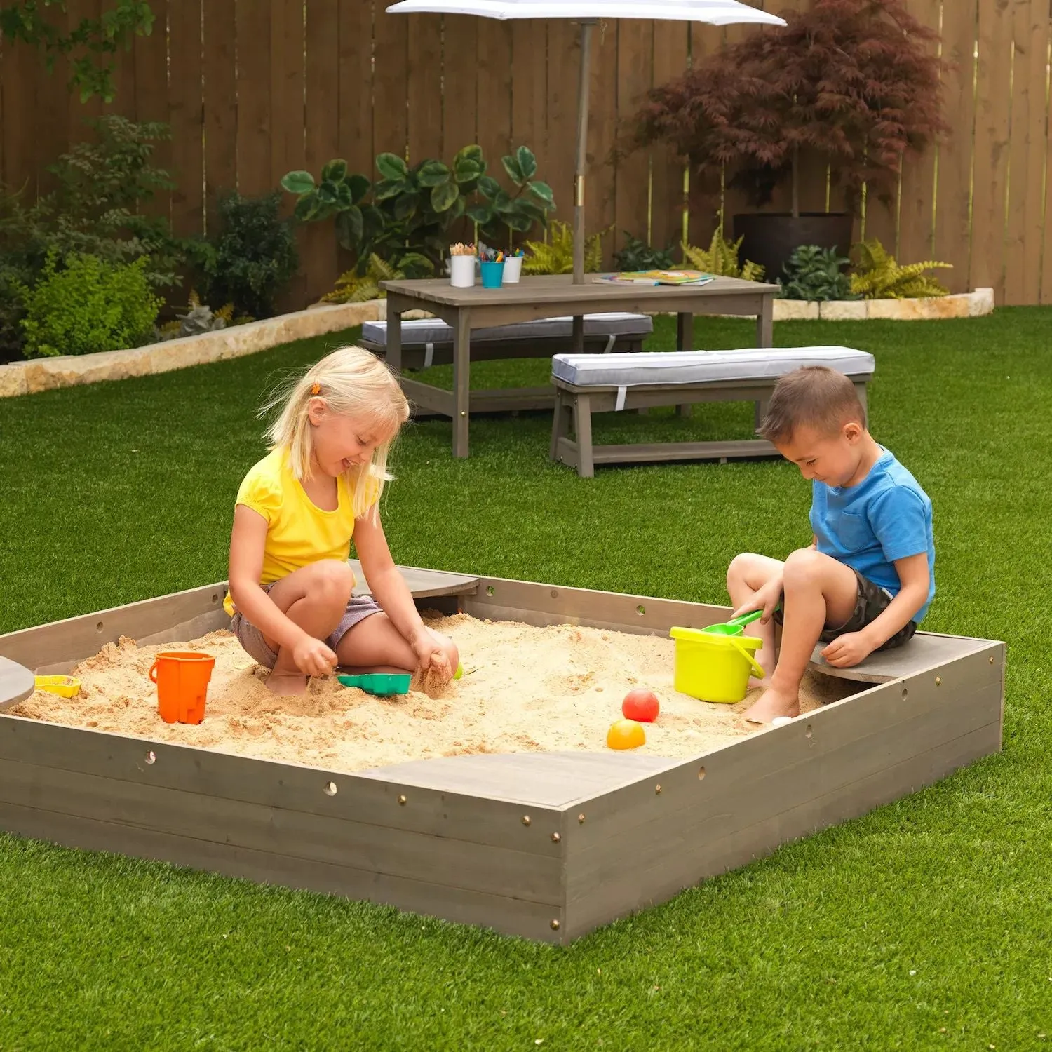 KidKraft Sandbox in the backyard KidKraft