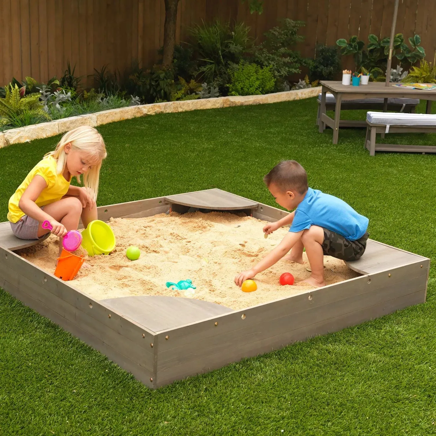 KidKraft Sandbox in the backyard KidKraft